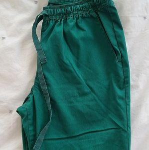 JAANUU Skinny pant in hunter green **size S**